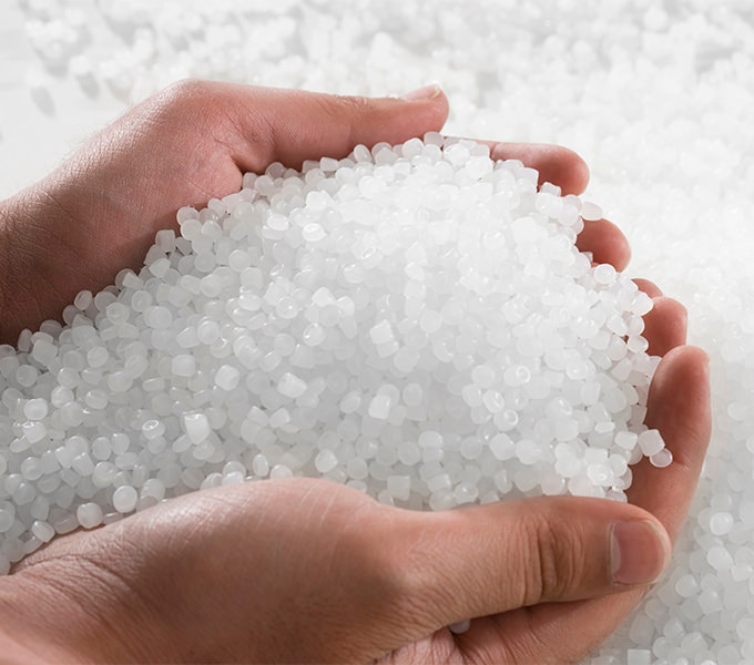 Plastic Resin pellets in holding hands